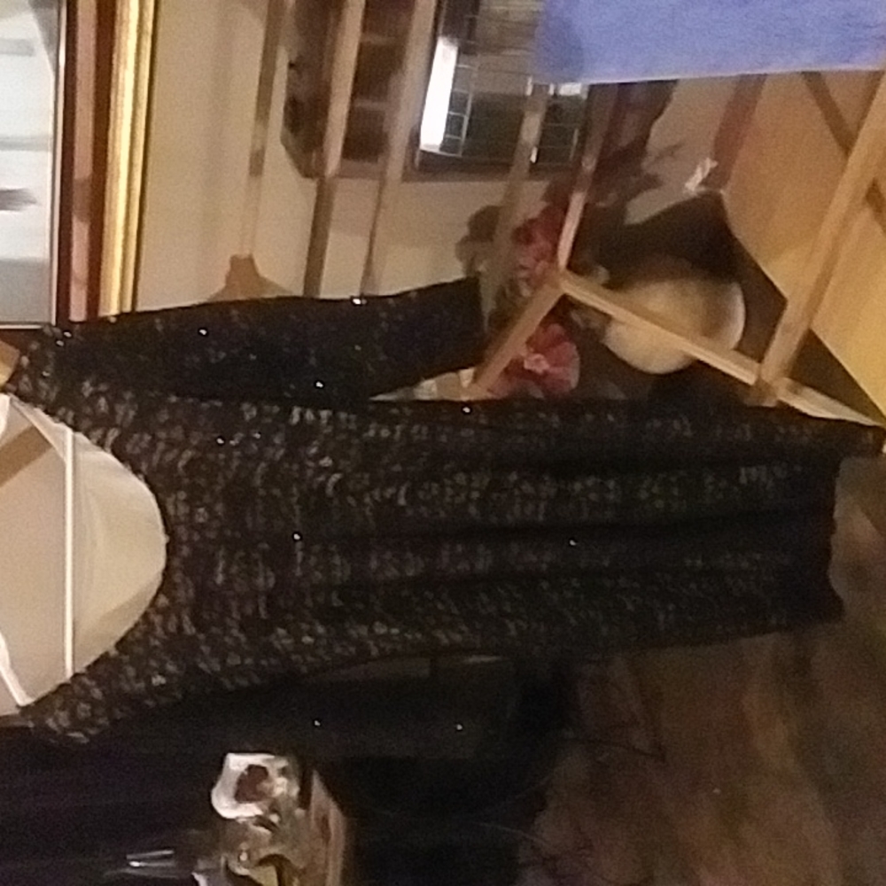 Black dress sparkles with tan under lay very elegant